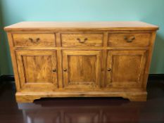 A Willis & Gambier oak and pine sideboard, fitted three drawers and cupboards,