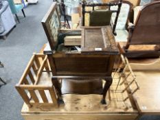 An oak sewing box and contents, and two magazine racks.