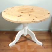 A modern painted pine tripod kitchen table, diameter 91 cm.