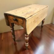 A Victorian pine drop leaf farmhouse table, length 106 cm.