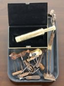 A reproduction brass Unitron telescope in case, together with a group of vintage corkscrews,
