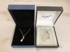 A silver heart pendant on chain, and a further silver double drop pendant on chain.