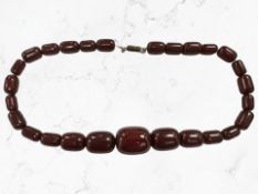 A graduated cherry Bakelite necklace, length 48 cm, gross weight 56.