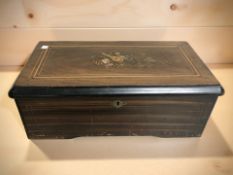 A 19th century rosewood and satinwood inlaid cylinder music box playing eight airs, width 36 cm.