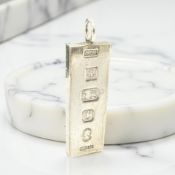 A silver ingot pendant, length 5cm CONDITION REPORT: 29.