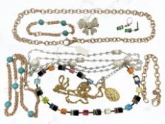 A group of costume jewellery including a Butler & Wilson brooch and further necklace,