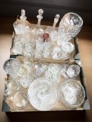A quantity of crystal and pressed glass including drinking glasses, decanters, vases, etc.