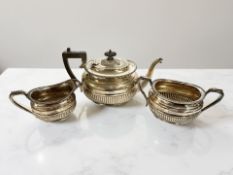 A silver three-piece tea service, Harrison Brothers & Howson, Sheffield 1893 and 1894,