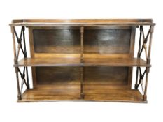 A reproduction mahogany three-tier wall shelf,