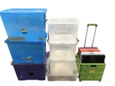 A group of plastic storage boxes with lids, largest 60 cm long.