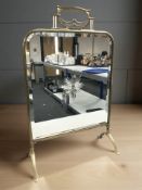 An Art Nouveau mirrored brass fire screen, height 71 cm.