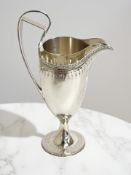 A Georgian silver cream jug, maker RP RS, no city or date letter, height 16cm.