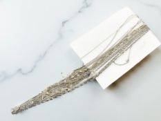 A group of silver and silver-gilt necklaces