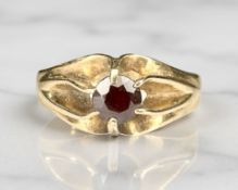 A 9ct gold garnet solitaire ring, size V CONDITION REPORT: 3.