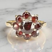 A 9ct gold garnet cluster ring, size O½ CONDITION REPORT: 3.