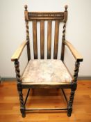 An oak barley twist carver armchair.