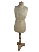 An early 20th century dressmaker's mannequin wooden torso on stand, stencilled 'A. W.