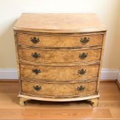 A reproduction burr walnut four drawer chest,