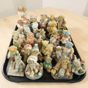 A collection of Cherished Teddies figurines.