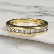An 18ct gold diamond thirteen stone half eternity ring, approximately 0.