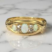 An 18ct gold opal and diamond ring, size P CONDITION REPORT: 3.