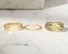Two 9ct gold band rings and a further knot ring stamped 9K,