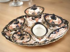 A 19th century Royal Crown Derby oval dressing table tray and several lidded boxes, ring stand, etc.