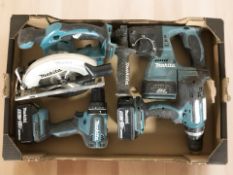 Three Makita power drills, two with batteries and a circular saw.