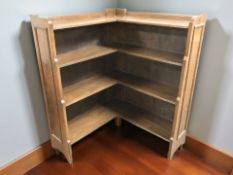 An Edwardian oak corner bookcase,