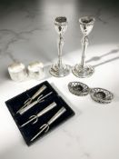 Two hallmarked silver napkin rings, a pair of candlesticks stamped Sterling, Made in Israel,