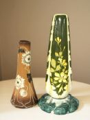 Two early 20th century decorative pottery jardiniere stands, tallest 65 cm.