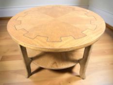A circular teak two-tier coffee table,
