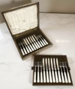 A George V oak canteen containing a twelve-place setting of silver and mother of pearl-handled fish