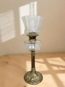A Victorian brass and clear glass oil lamp with etched glass shade, total height 68 cm.