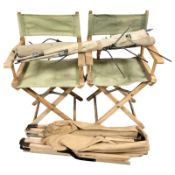 Two director's style chairs and a folding camp bed