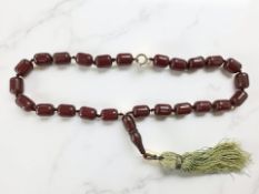 A cherry Bakelite bead necklace, length 49cm.