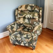 A contemporary armchair in William Morris pattern upholstery