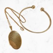 A 9ct gold locket on trace link chain,
