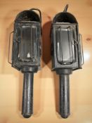 A pair of antique coach lamps containing candles, length 36 cm.