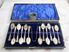 A set of twelve silver teaspoons and matching tongs, Birmingham marks (box a/f),