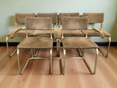 A set of six metal framed cantilever chairs.