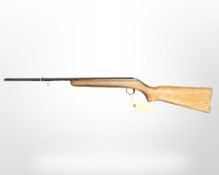 A vintage air rifle stamped BC32628, break action .22 calibre.