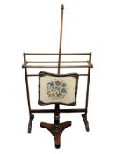 A 19th century mahogany towel rail and a tapestry pole screen.