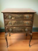 A 20th century mahogany three drawer chest on cabriole legs, width 47 cm.