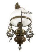 A cast brass and turned wooden pendant light fitting with opaque glass shade,