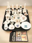 A group of Goss and other crested ornaments including dishes, British World War I tank,