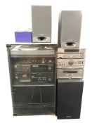 A Sharp hi-fi system with speakers,