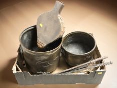 An embossed copper planter, further brass planter, fire bellows and fire companion pieces.