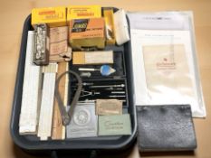 A group of slide rules, a precision drawing set, Kodak items including colour film transparencies,