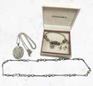 A fancy link necklace stamped 925, Pandora charm bracelet in box, a pair of earrings,